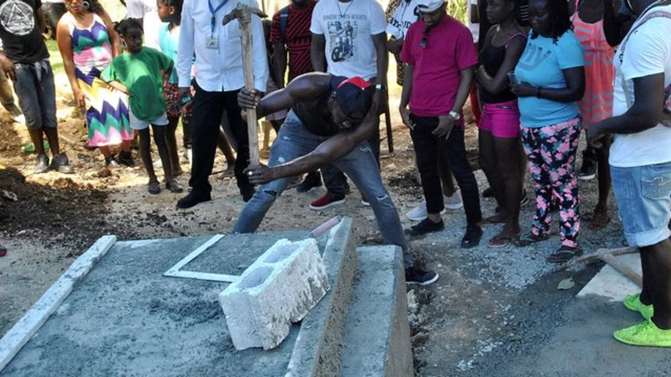 Usain Bolt ásta ki barátja sírját