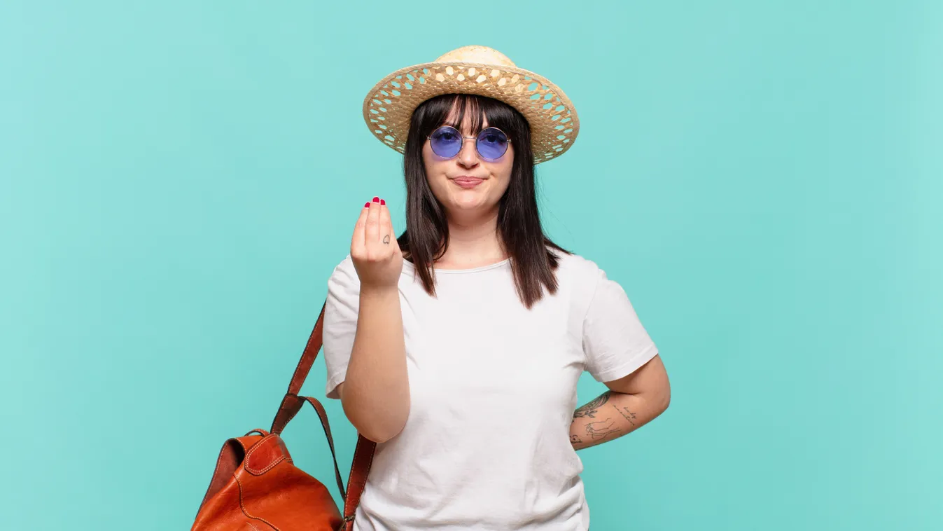 Young,Traveler,Woman,Making,Capice,Or,Money,Gesture,,Telling,You
