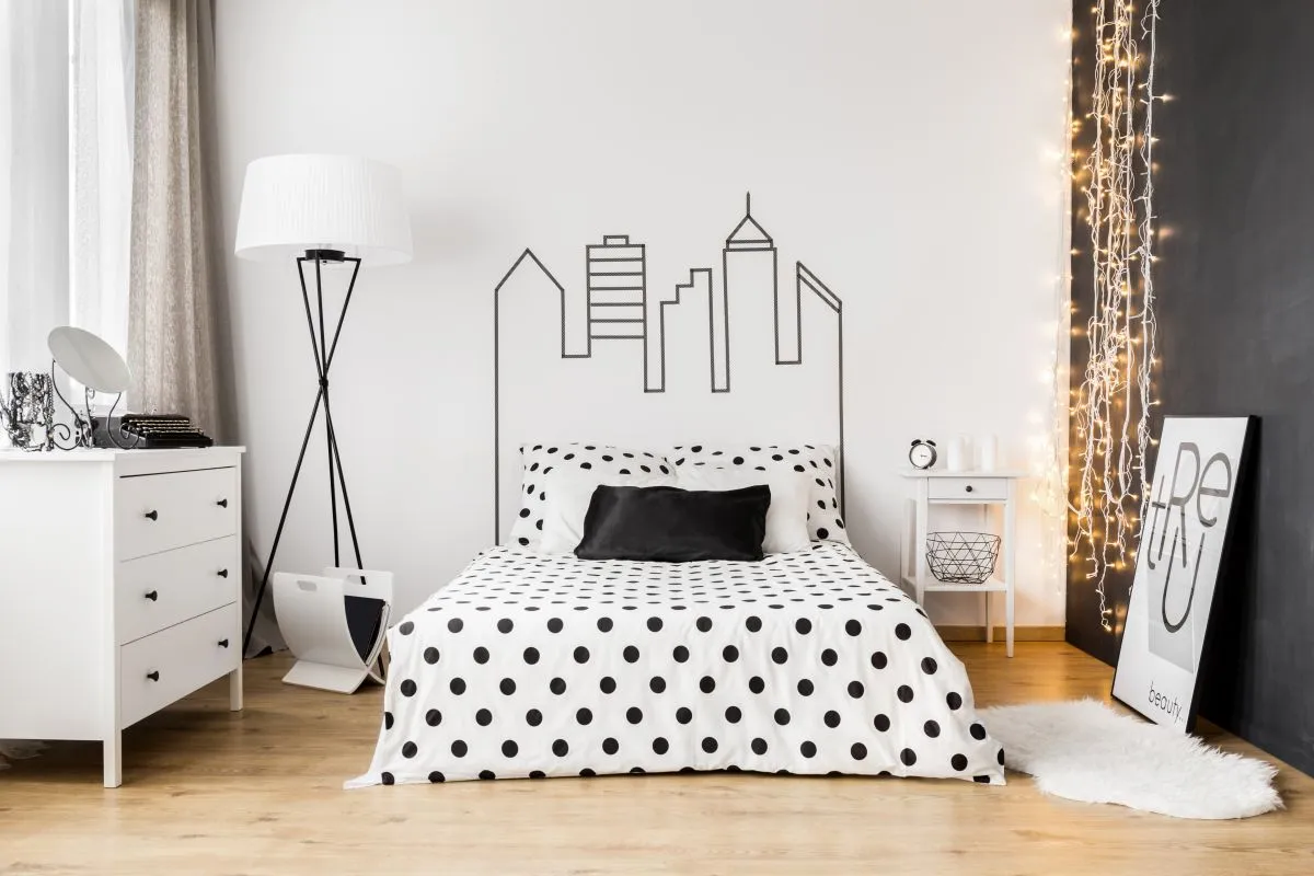 Bright,Bedroom,Interior,With,Wide,Bed,,Commode,And,One,Black