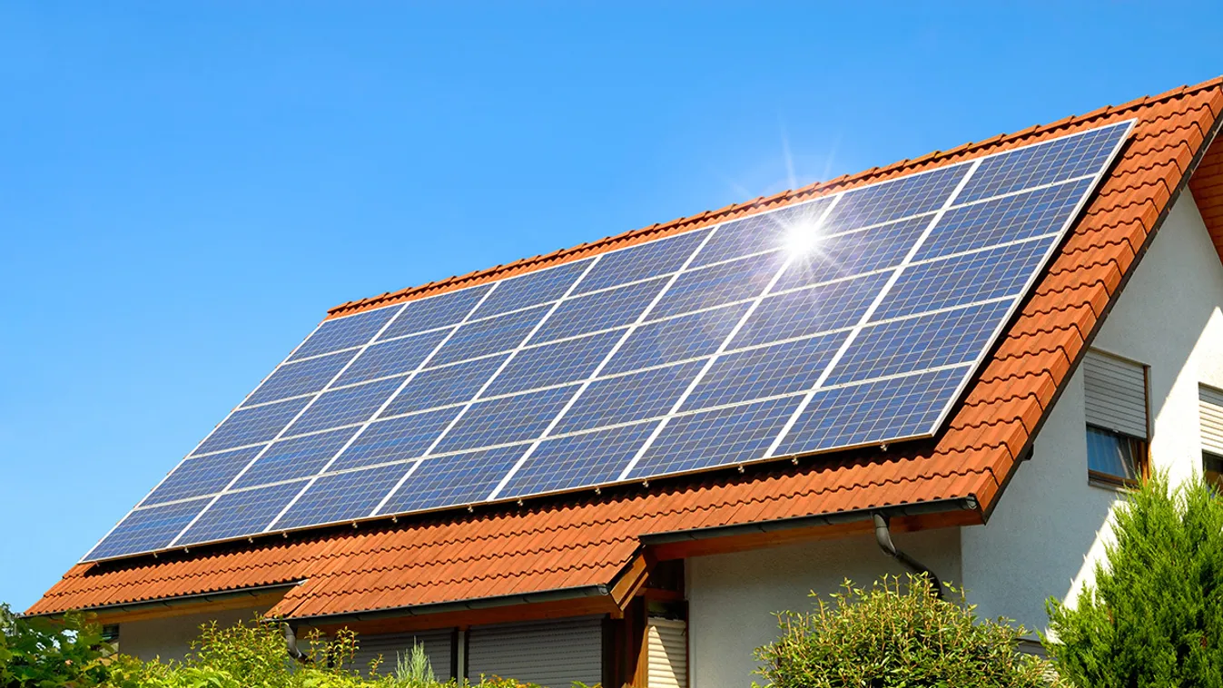 Solar,Panel,On,A,Red,Roof,Reflecting,The,Sun,And