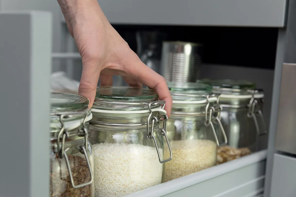 Women,Picking,An,Item,From,Storage,Hutch.,Smart,Kitchen,Organization