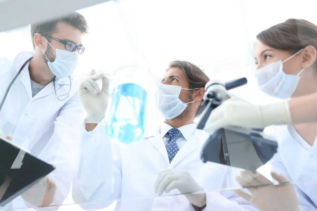 Young,Scientists,Working,With,A,Microscope,And,Test,Tubes
