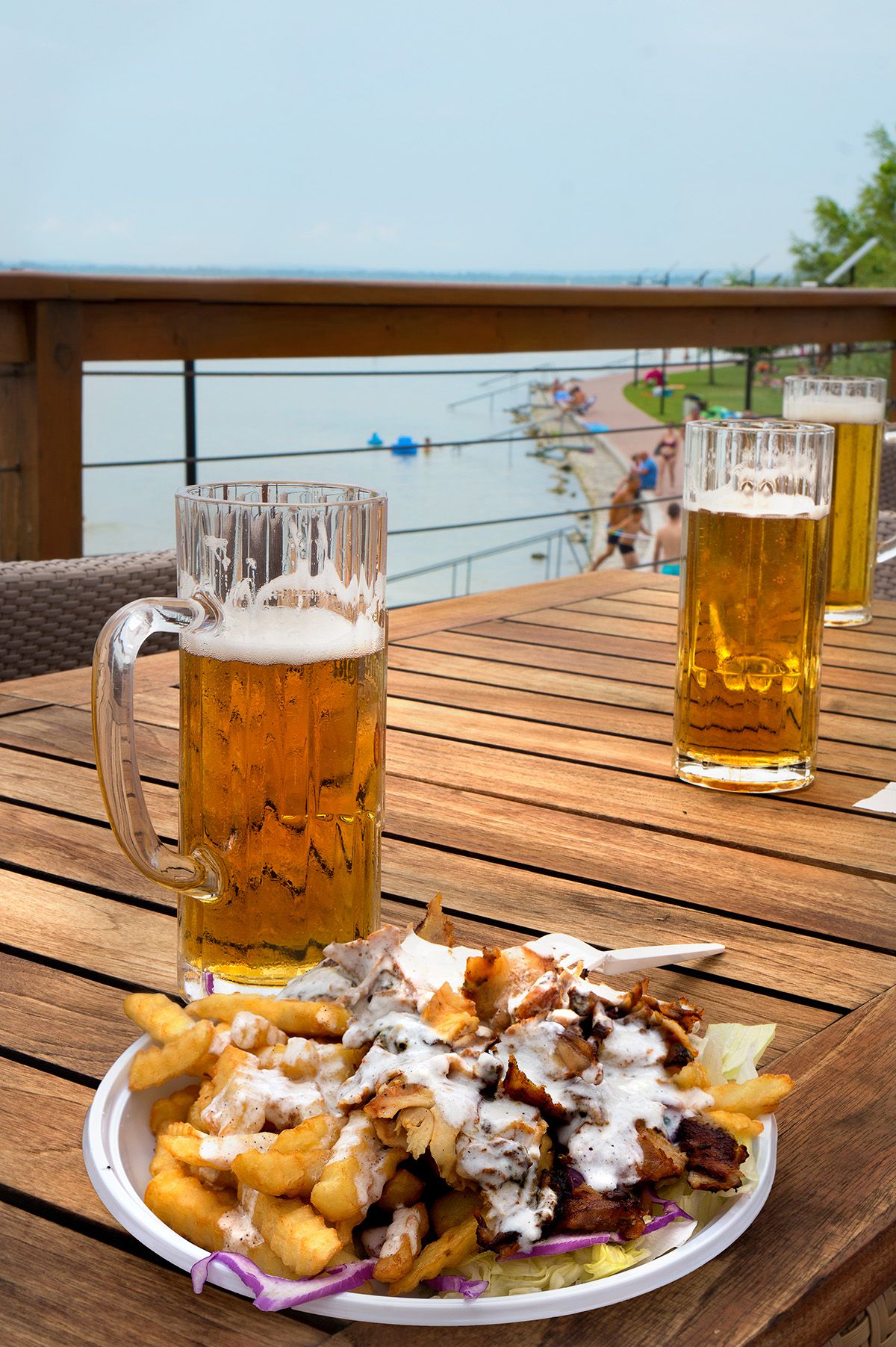 Gyros,Plate,With,French,Fries,And,Beer,On,The,Beach
