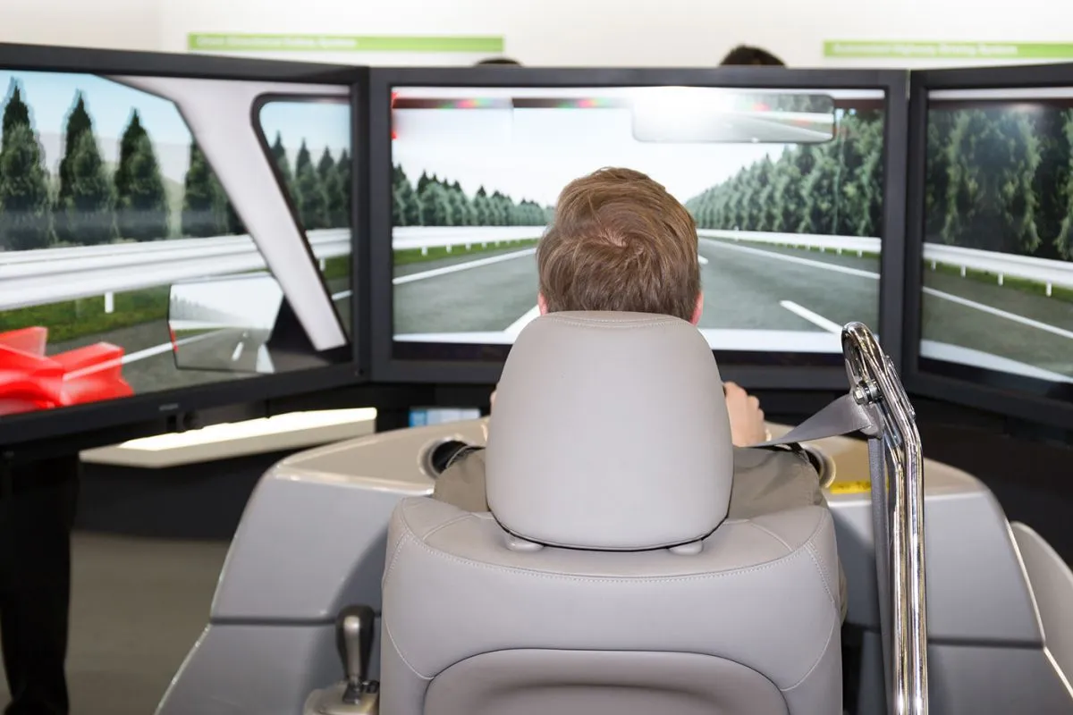 Man,In,A,Car,Simulator,To,Study,Safety,And,Reflexes