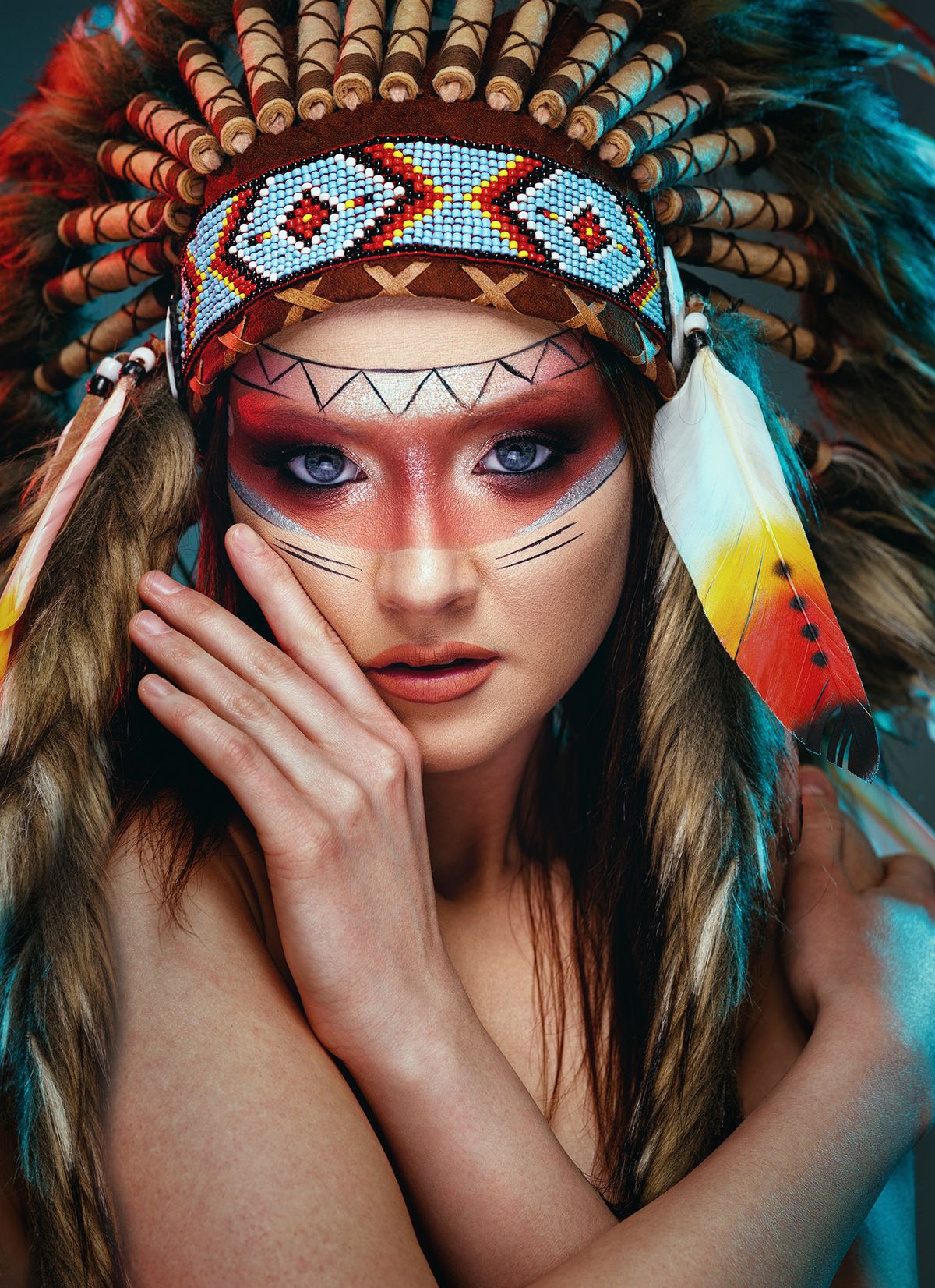 Young,Beautiful,Indian,Female,With,Feather,Headdress