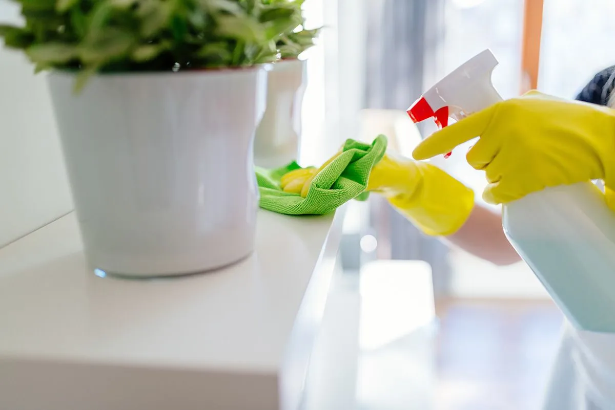 Woman,Wearing,Yellow,Rubber,Protective,Gloves,And,Cleaning,White,Shelf.