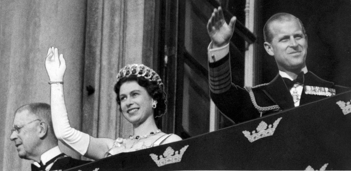 King Gustaf VI Adolf, Queen Elizabeth II and Prince Philip waving to the crowds from the balcony towards Lejonbacken at Stockholm Castle in connection with the Queen's state visit to Stockholm June 8, 1956. 
Photo:  TT code 20360 (Photo by TT / TT NEWS AGENCY / TT News Agency via AFP)