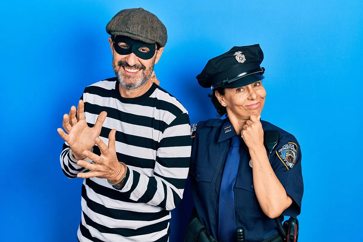 Middle,Age,Couple,Of,Hispanic,Woman,And,Man,Wearing,Thief