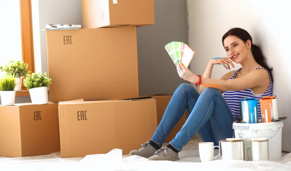 Woman,Choosing,Paint,Colour,From,Swatch,For,New,Home,Sitting