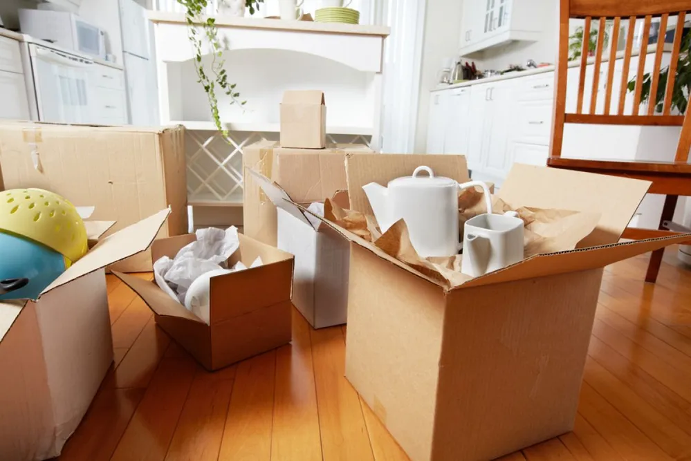 Moving,Boxes,In,New,House.,New,Apartment,Background.