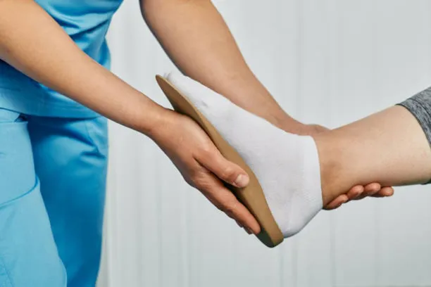 Orthopedic insoles. Orthopedist fitting individual orthopedic insole for patient foot