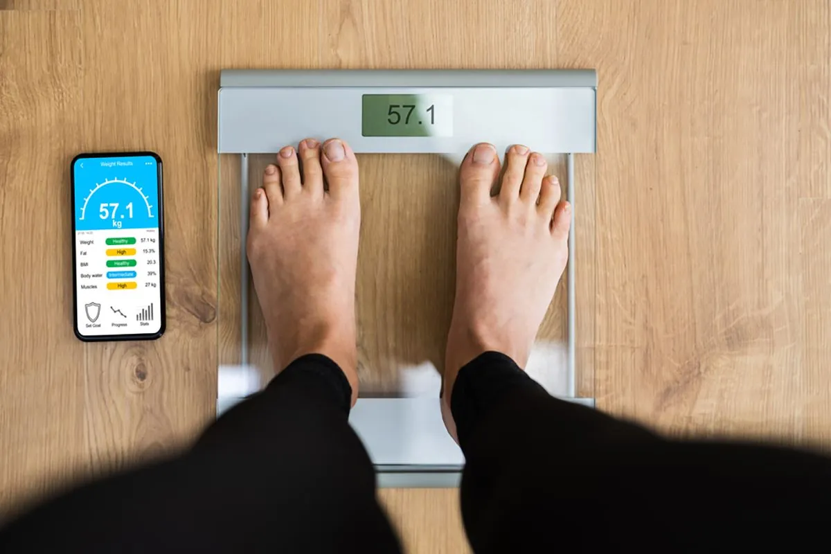 Woman,Using,Smart,Weight,Scale,Measurement,Tech