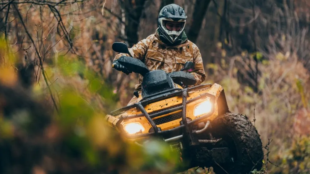 Male,Driving,Fix,Quad,Through,The,Forest