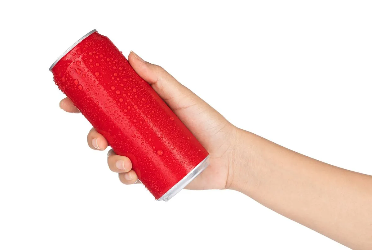 Hand,Holding,Red,Aluminum,Cans,With,Fresh,Water,Drops,Isolated