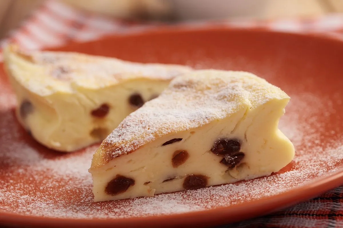 Two,Slices,Of,Traditional,Polish,Cake,Sernik,With,Raisins