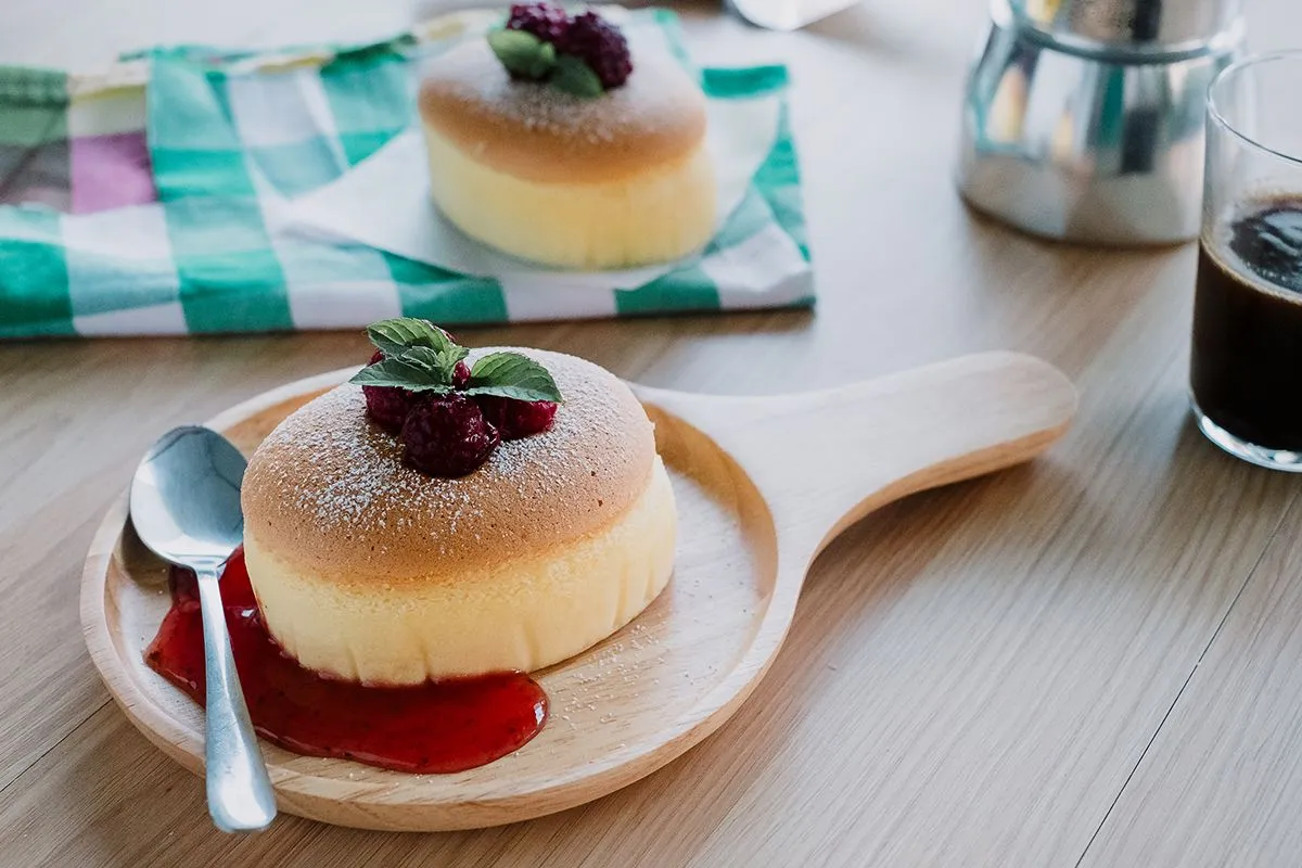 Wooden,Desk,With,Japanese,Cheesecake,And,Cup,Of,Coffee,In
