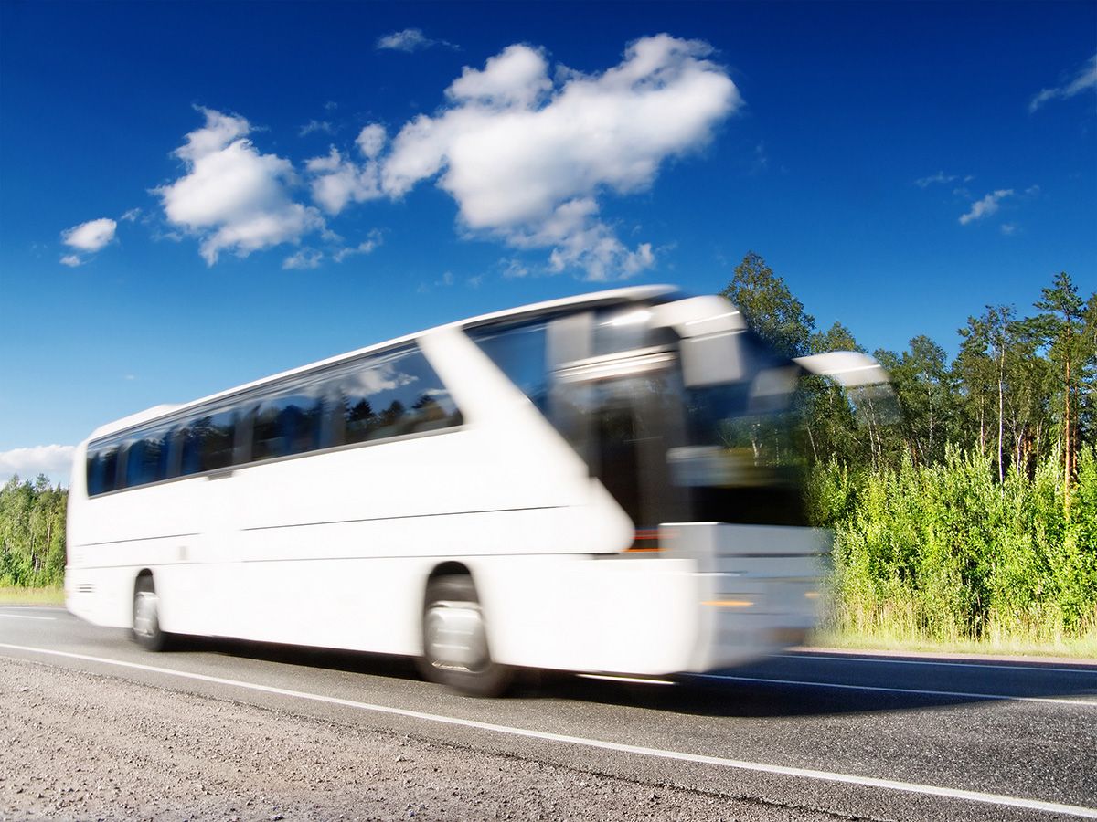 White,Tourist,Bus,Speeding,On,Highway,,Blured,In,Motion