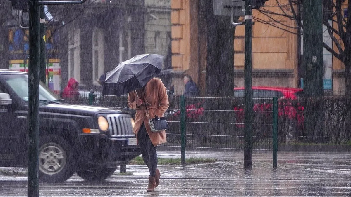 A,Woman,In,A,Brown,Coat,Under,An,Umbrella,Crosses