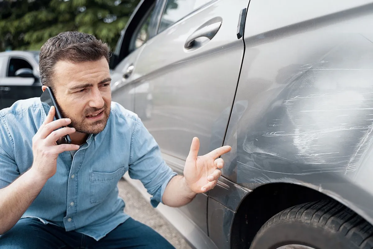 One,Man,Reporting,Car,Damage,Calling,Insurance,Service