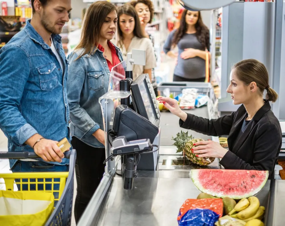 People,Buying,Goods,In,A,Grocery,Store