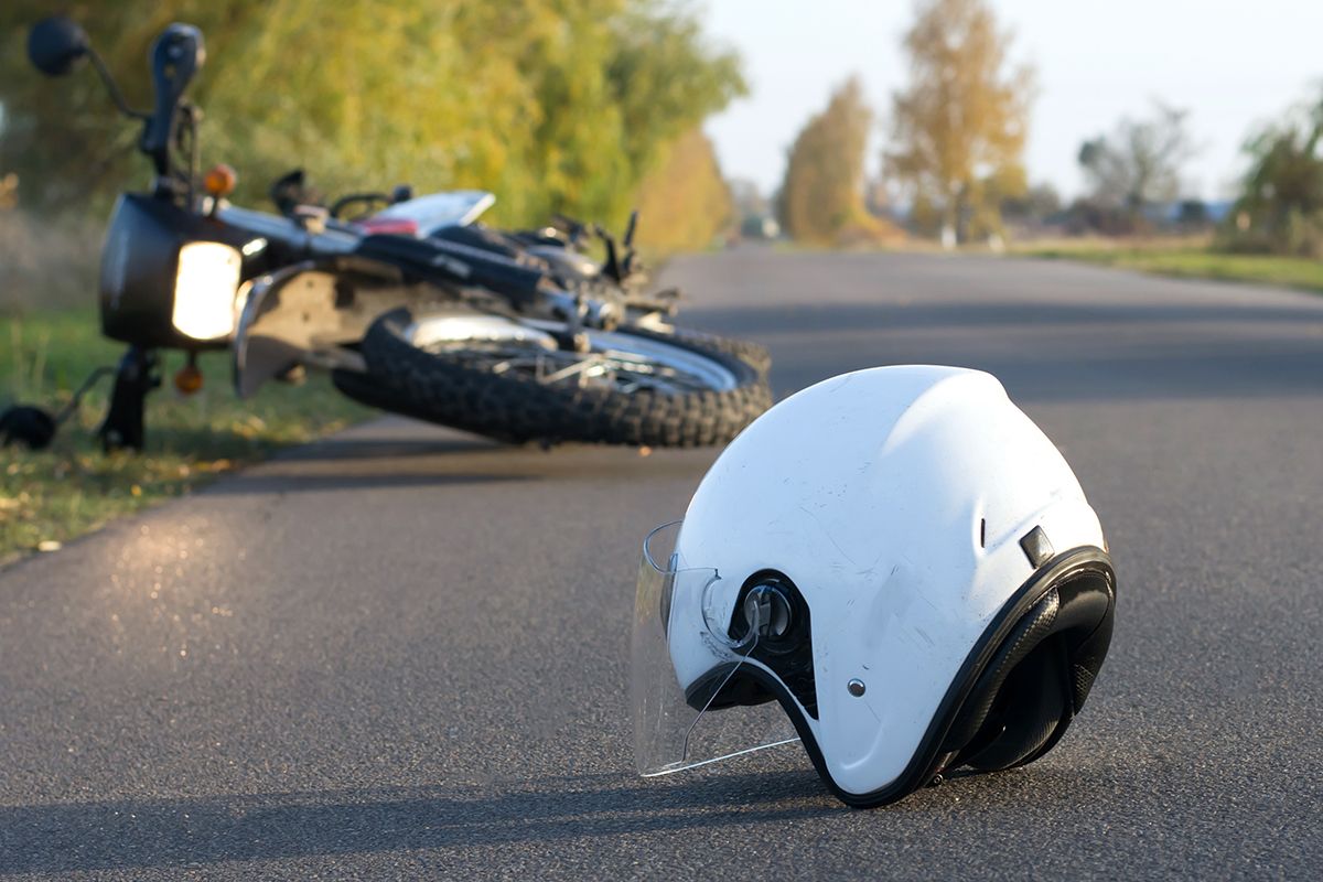 Photo,Of,Helmet,And,Motorcycle,On,Road,,The,Concept,Of