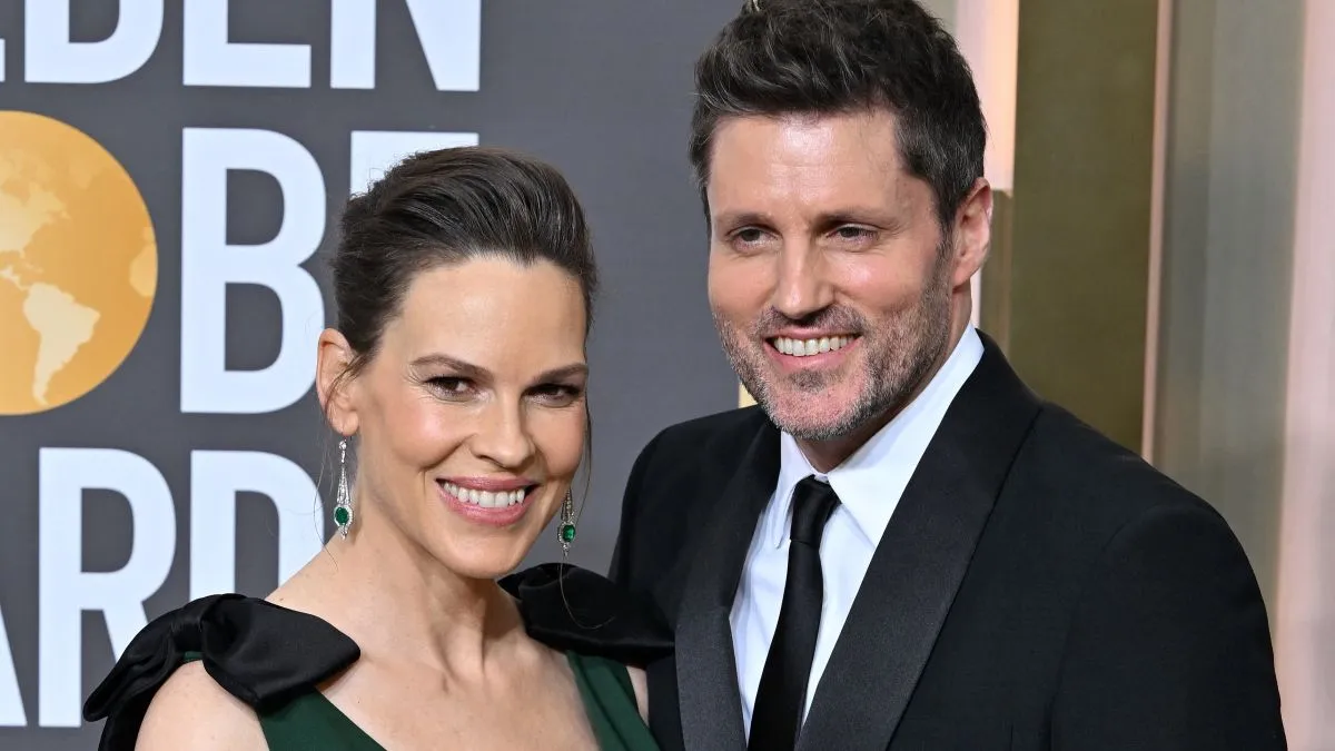 Hilary Swank és férje, Philip Schneider fotó: AFP