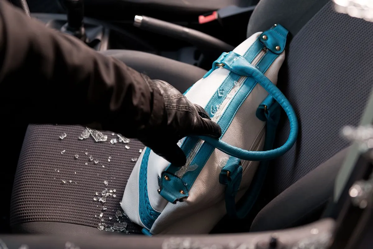 Robber,Breaking,A,Car's,Windows,To,Steal,A,Woman,Bag.