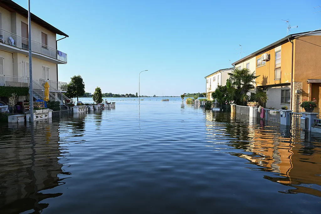 A general view shows a flooded street on May 21, 2023 in Conselice, near Ravenna, after deadly floodwaters hit the Emilia-Romagna region. More than 36,000 people have now been forced from their homes by deadly floods in northeast Italy, regional officials said, as rising waters swallowed more houses and fresh landslides isolated hamlets. Violent downpours earlier this week killed 14 people, transforming streets in the cities and towns of the Emilia Romagna region into rivers. (Photo by Andreas SOLARO / AFP)