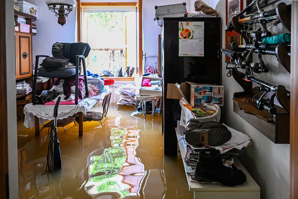 A flooded house is pictured on May 20, 2023 in the village of Ghibullo, near Ravenna, after floodwaters hit the Emilia-Romagna region. The toll from floods that have devastated Italy's Emilia Romagna region rose to 14 on May 19, amid calls for the government to revive an abandoned project to mitigate the impact of natural disasters. (Photo by Andreas SOLARO / AFP)