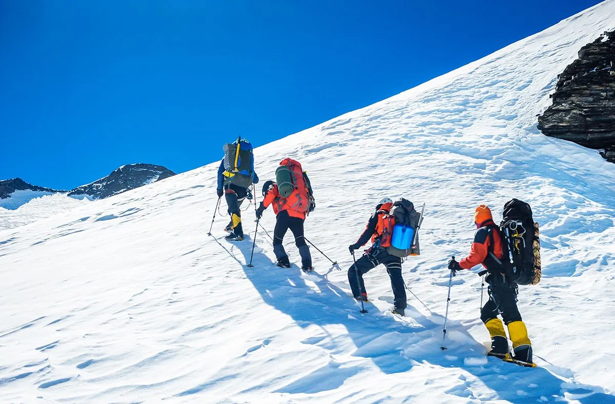 Goup,Of,Climbers,Reaching,The,Simmit.,Team,Work,Concept