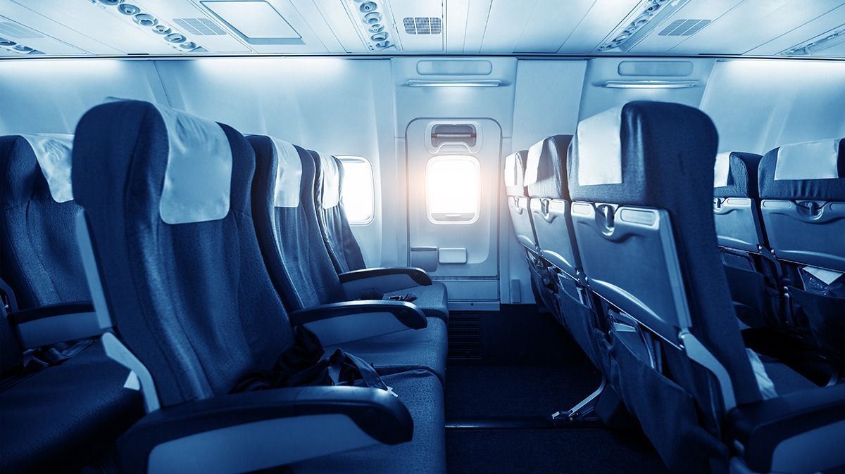 Comfortable,Seats,In,Cabin,Of,Huge,Aircraft,With,Screens,In