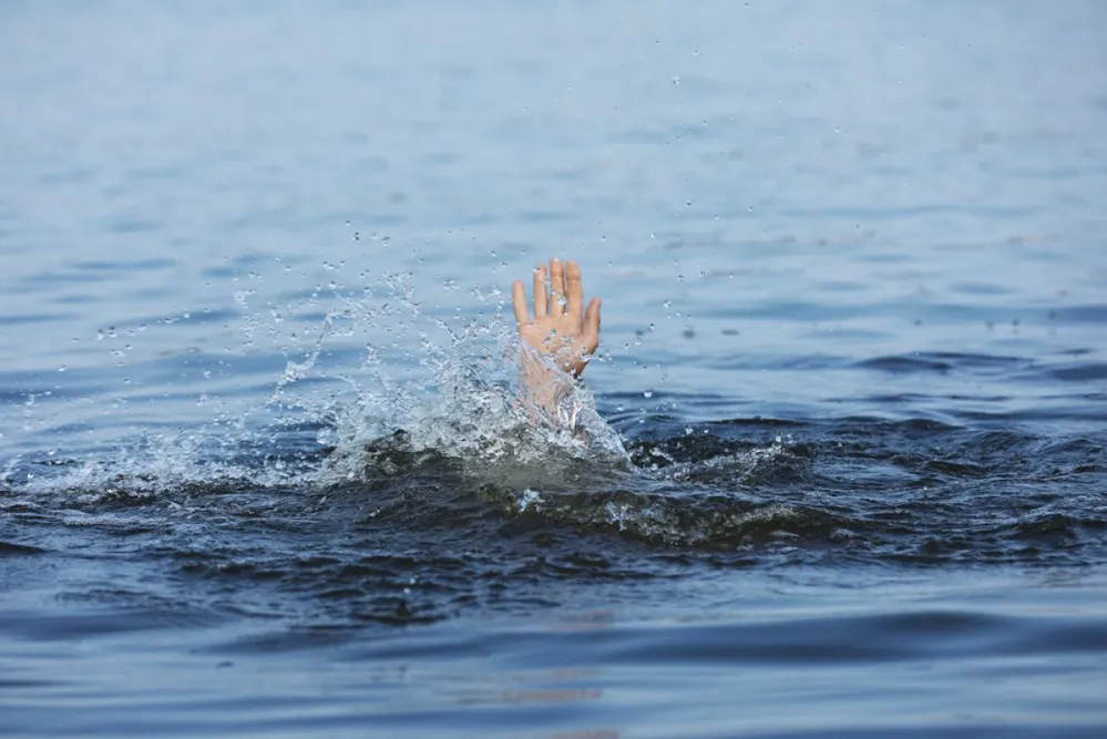 Drowning,Man,Reaching,For,Help,In,Sea,,Closeup