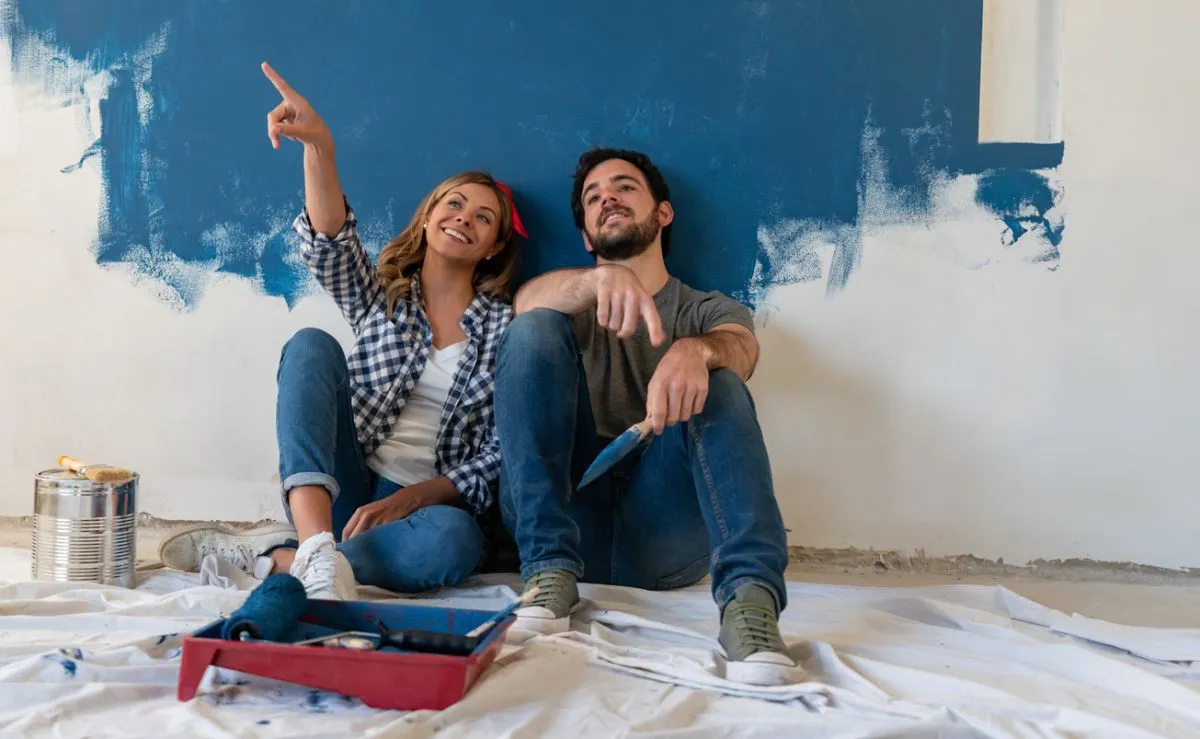 Couple remodeling their house and taking a break from painting