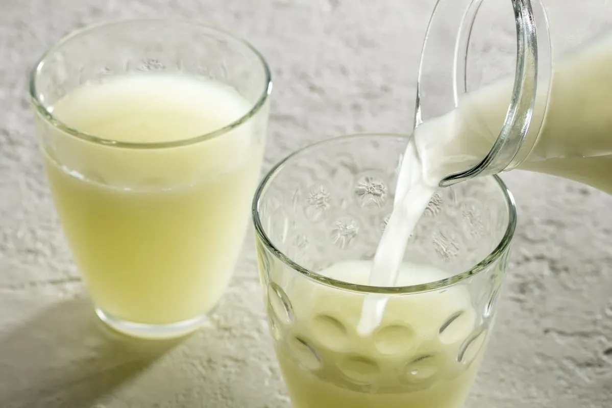 Pouring,Natural,Whey,From,A,Jug,Into,A,Glass