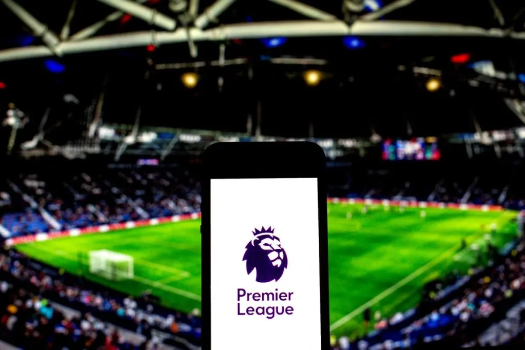 Photo Illustration Of Football And More Logo Seen Displayed On A Smartphone