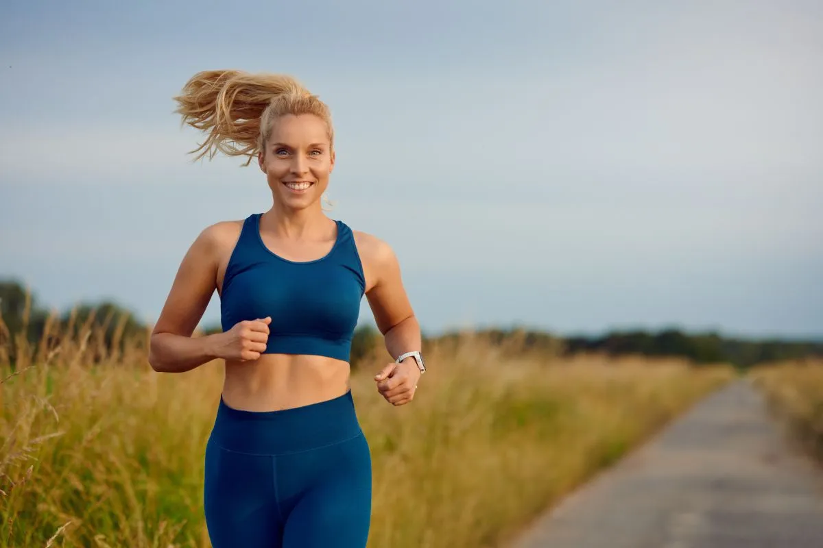 Fit,Healthy,Young,Woman,Enjoying,A,Jog,Along,A,Country