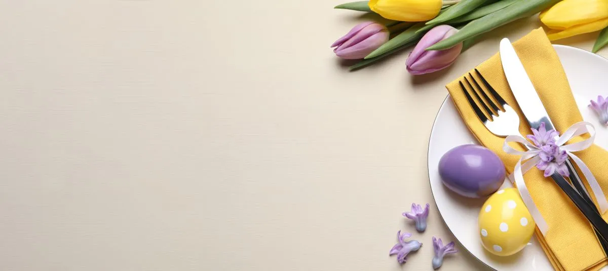 Festive,Easter,Table,Setting,With,Eggs,On,Beige,Background,,Flat