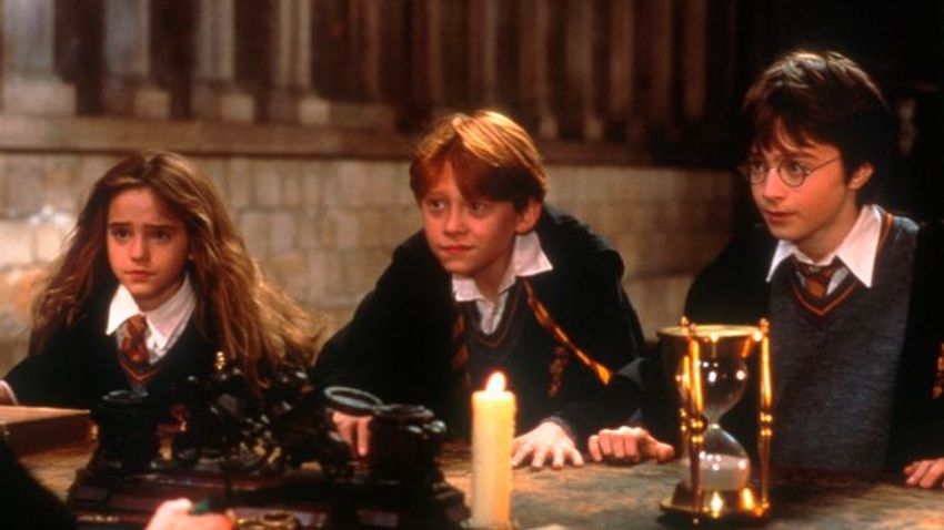 Melyik a fölösleges szó a mondatban? "He was given Harry Potter and The Philosopher's Stone by his "flabbergasted" father in 1997, when he realised it was about a wizard together with his son's name"