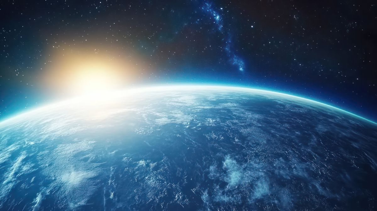 Realistic,Earth,Planet,With,A,Blue,Atmosphere,And,Space,Background.