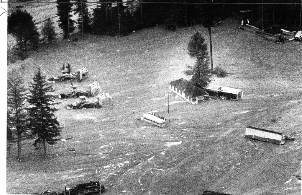 Buildings autos, and a bus enveloped in mud flowing near Mount St. Helens after the volcano erupted,  May 22,  1980 Photo ran 05/23/1980, P. 22