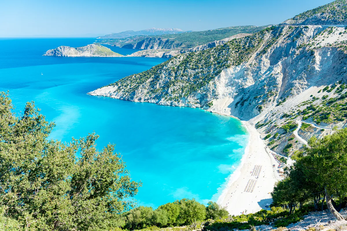 High angle view of Myrtos beach by the crystal clear sea in summer, Kefalonia, Ionian Islands, Greece