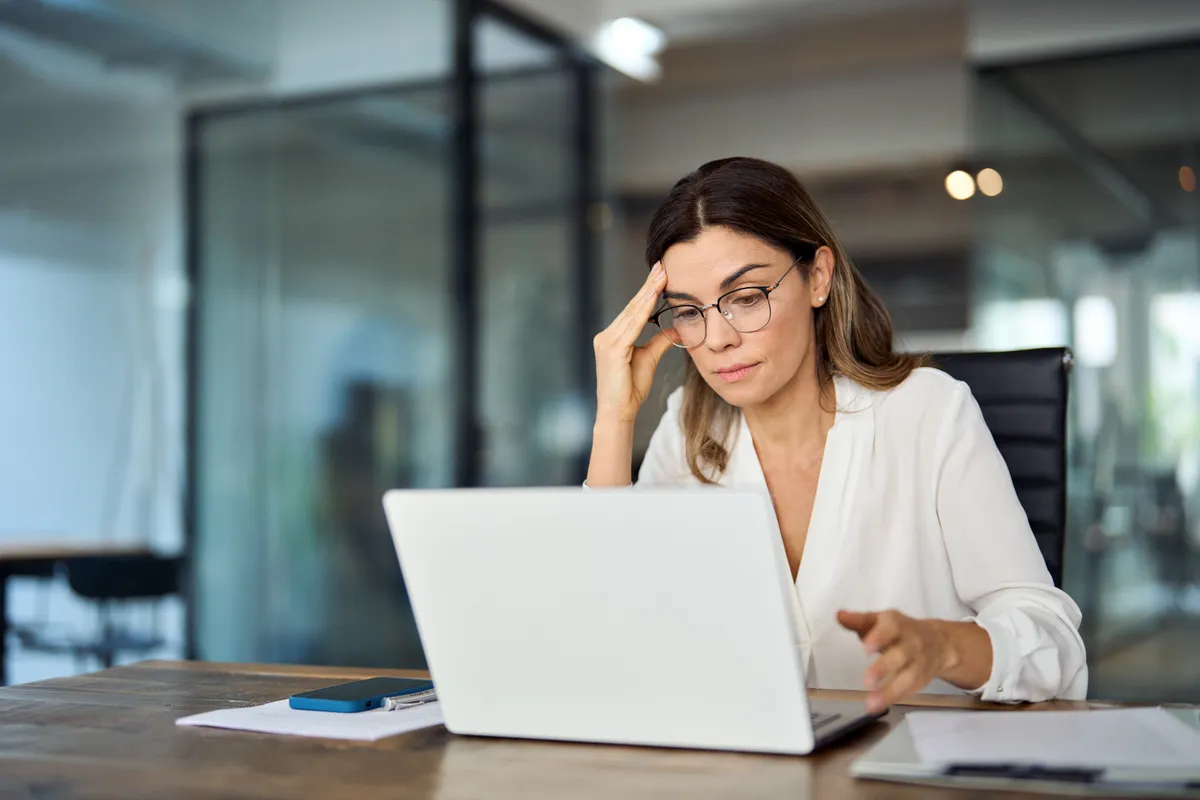 Worried,Fatigued,Mature,Business,Woman,Wearing,Glasses,Having,Headache,At
