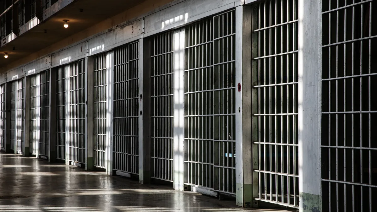 An,Empty,Prison,Cell,Block,With,Metal,Bars,And,Sunlight