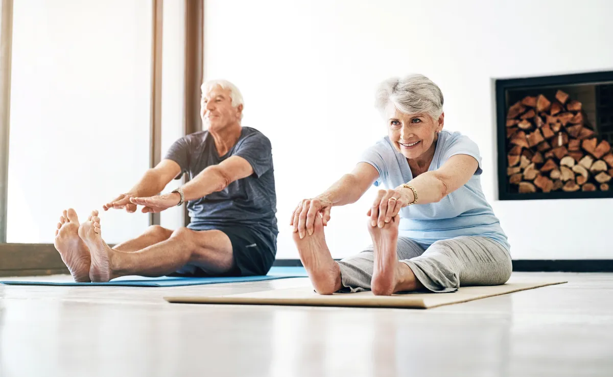 Legs,,Stretching,And,Senior,Couple,With,Yoga,,Exercise,And,Pilates