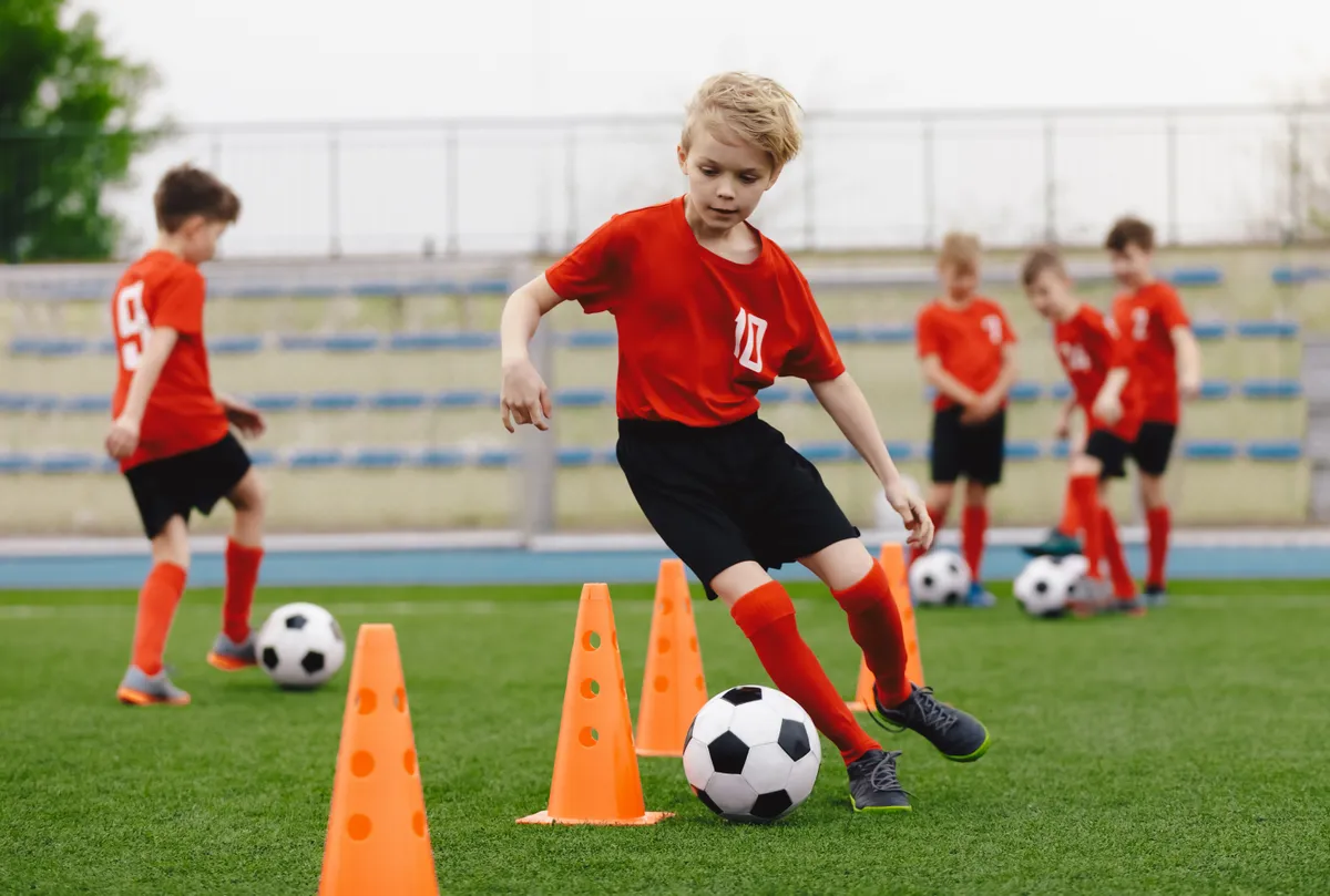 Boys,On,Soccer,Football,Training.,Young,Players,Dribble,Ball,Between