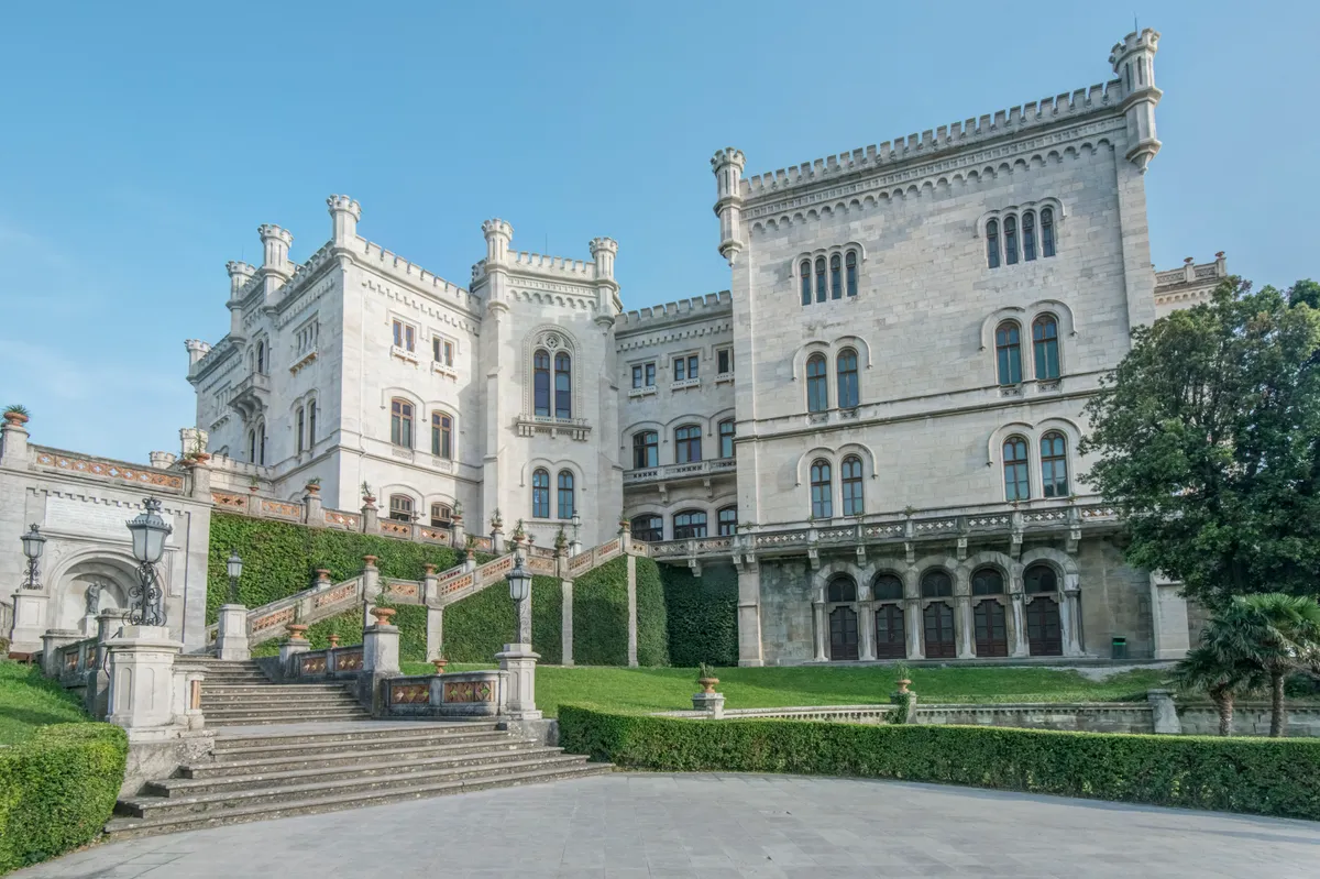 Italy,Exterior of Miramare Castle with lawns and steps, Trieste, Italy.