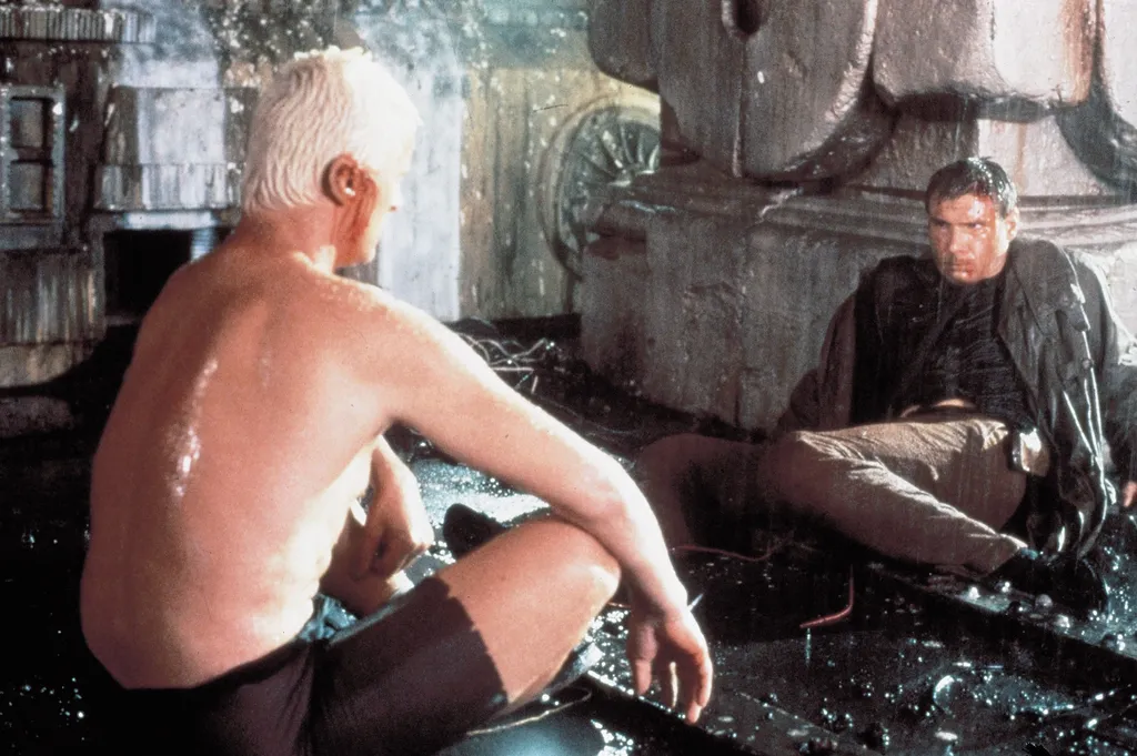 1982; Blade Runner. Original Film Title: Blade Runner, PICTURED: HARRISON FORD, RUTGER HAUER, Composer: Vangelis, Director: Ridley Scott, IN CAST: Rutger Hauer, Sean Young, Harrison Ford, Daryl Hannah, Edward James Olmos, M. Emmet Walsh, Joe Turkel, Brion