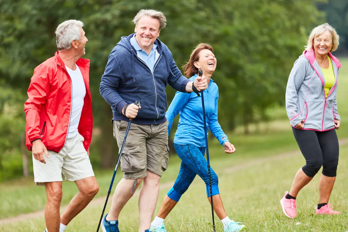 Cheerful,Vital,Group,Of,Seniors,Together,While,Hiking,In,Nature