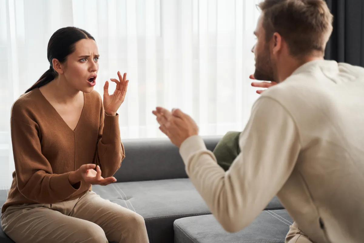 Conflict,In,The,Family.,Angry,Emotional,Man,Sitting,Near,His