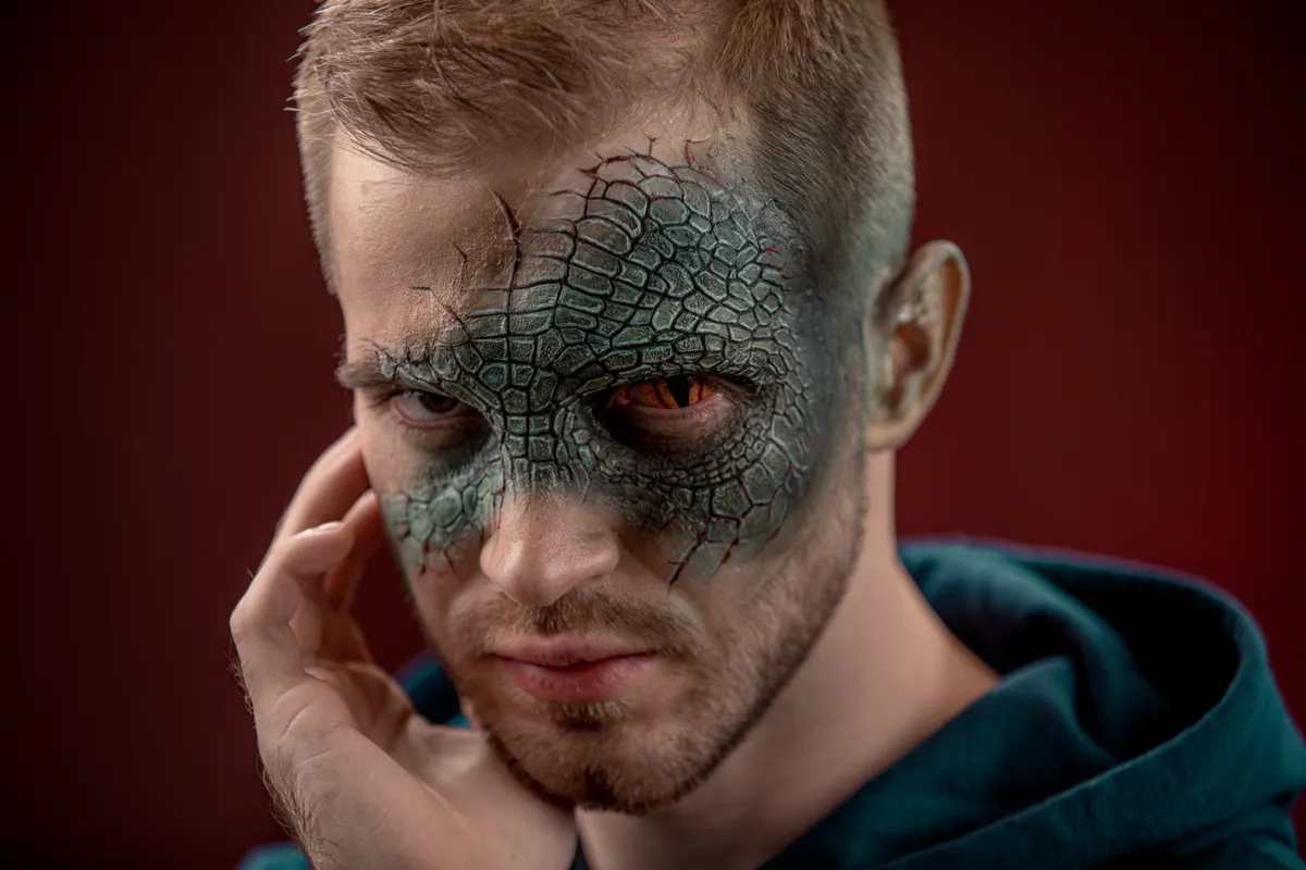 Man,With,Professional,Horror,Movie,Make-up,Green,Lizard,On,Dark